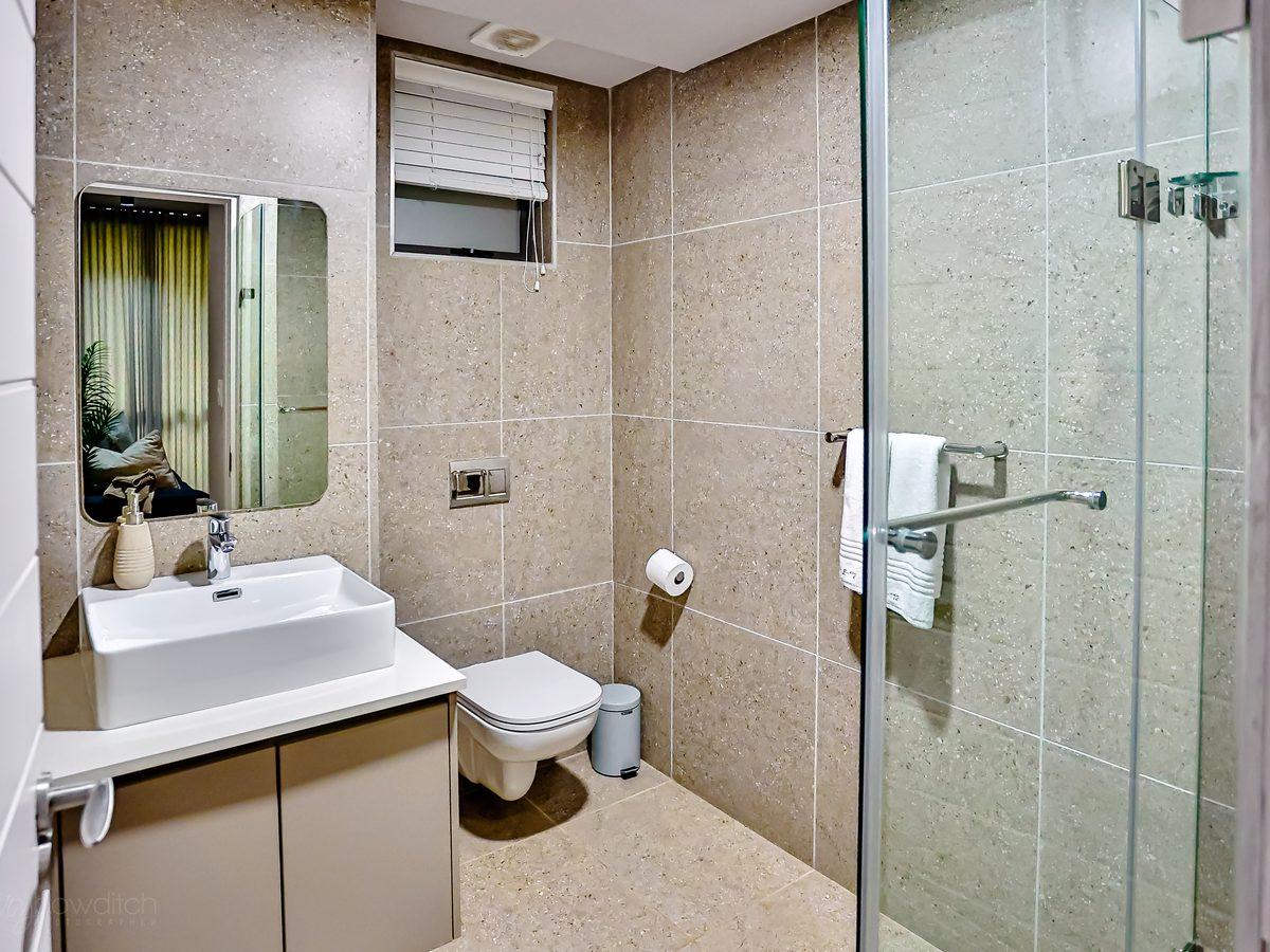 Bathroom with vanity and walk-in shower